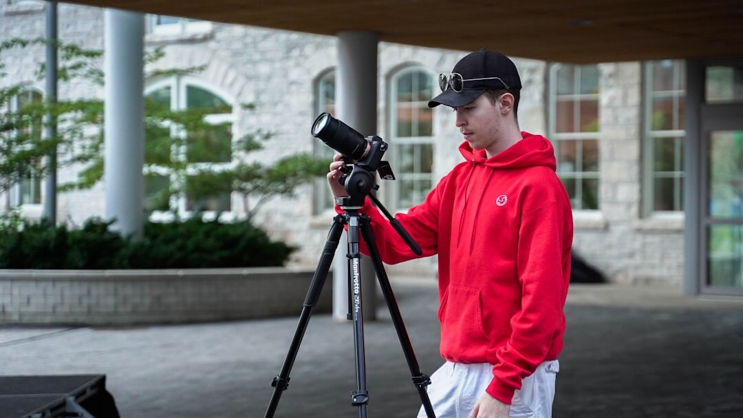 Student practicing on-camera reporting with teleprompter